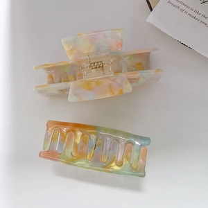 Colorful acetate hair claw clip set with rainbow mosaic pattern and gold metal spring