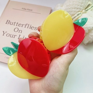 Simpatiche mollette per capelli in acetato a forma di mela rossa e gialla con foglia