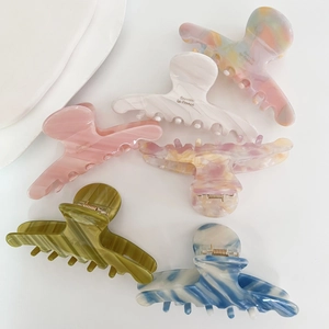Elegant tortoiseshell acetate hair claw clips in various colors for stylish updos