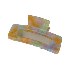 Large iridescent acetate hair claw clip with colorful marble pattern and hollow rectangular design