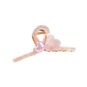 Pink acetate heart hair claw clip with iridescent shell texture and golden metal spring