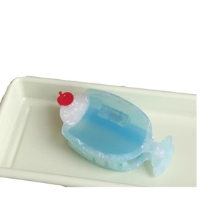 Blue cream soda ice cream hair claw clip with cherry accent and white foam detail