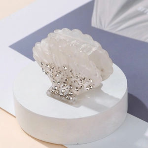 Sparkling shell hair claw with rhinestones in pearl white acrylic for elegant updos