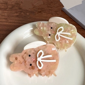 Pinces à cheveux lapin en acétate avec texture marbrée et détails de nœud blanc