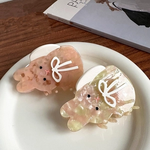Pinces à cheveux lapin en acétate avec texture marbrée en rose et jaune vif