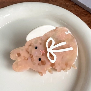 Pince à cheveux lapin en acétate marbré rose avec petit nœud blanc élégant