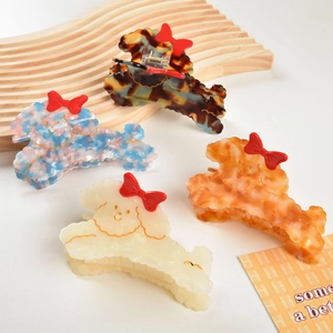 Cute puppy-shaped hair claws in four colors with vintage acetate finish and red bows