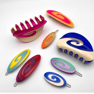 Detail view of colorful swirl acetate hair claw clips and barrettes set in pop art style