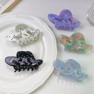 Pinze per capelli a farfalla traforate con strass blu in colori assortiti raffinati