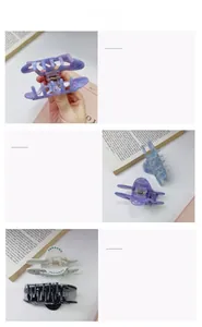 Dettaglio della pinza a farfalla traforata con trama in acetato marmorizzato e strass blu