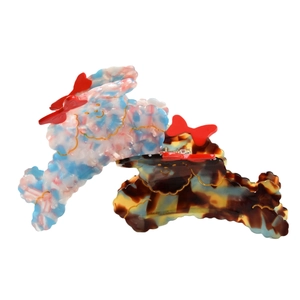 Cute poodle acetate hair claws with marble and tortoiseshell patterns and red bows