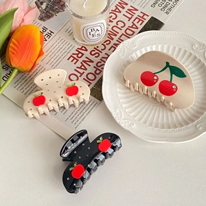 Three elegant acetate hair claw clips with cherry and apple motifs and rhinestones