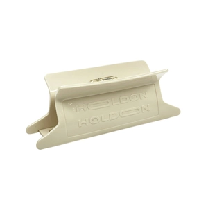 Detailed side view of cream acetate hair claw clip with embossed HOLDON lettering