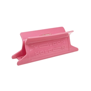 Pink acetate rectangle hair claw clip with HOLDON embossed design on a white background
