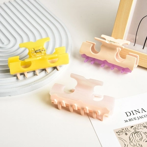 Three-piece acetate T-shape hair claws in cream, yellow, and pink for women hairstyles