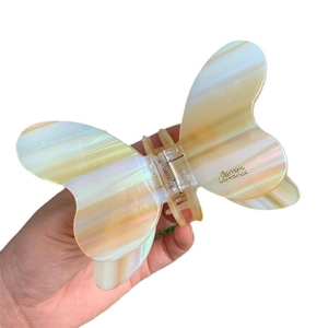 Iridescent butterfly hair claw clip with Barrette La France gold lettering for women