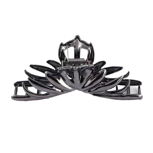 Polished black metallic crown-shaped shark hair claw clip for elegant bun hairstyles