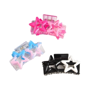 Star shaped Y2K hair claw clips set in pink, gradient blue and black white acrylic