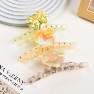 Detailed set of three colorful acetate shell hair claws with shimmering rhinestones