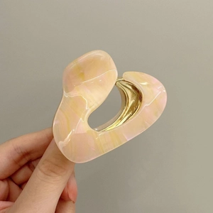 Pink marble acetate hair claw clip with heart shape design and gold metal spring