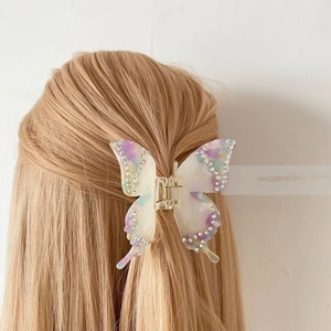 Elegant purple marble acetate butterfly hair claw clip with rhinestones on blonde hair
