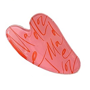 Pink acrylic heart hair claw clip with red script design on white background