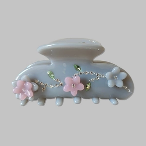 Elegant floral acetate hair claw clip with colorful resin flowers and rhinestone details