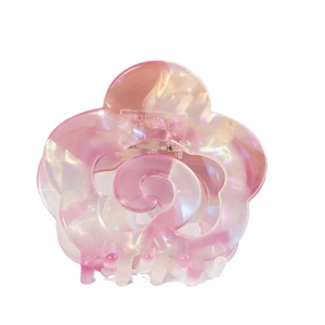 Elegant hollow floral hair claw with pink marble acetate finish and pearlescent shine