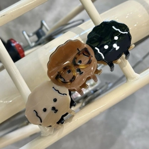 Three cute acetate cartoon dog hair claws in beige brown and black for women