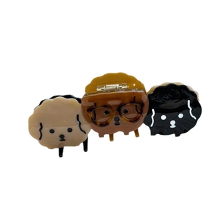 Three cute acetate cartoon dog hair claws in beige, brown and black for stylish styling