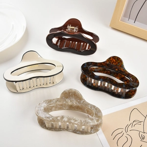 Large acetate hair claws in tortoise shell and cream marble finish for thick hair