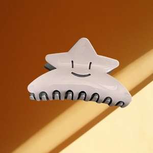 Pince à cheveux étoile en acétate avec motif smiley noir de couleur gris clair