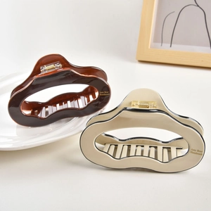 Vintage large acetate hair claw clip set in amber and cream white with gold accents