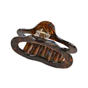Large acetate hair claw clip with vintage amber tortoise shell texture and gold metal spring