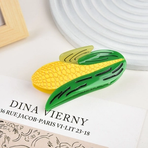 Detail of a vegetable corn hair claw clip made of glossy acetate resin for elegant styling