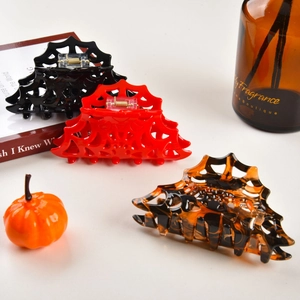 Hollow spider web claw clips for Halloween hair styling in black, red and tortoiseshell