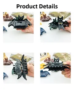 Detailed views of black bat-shaped hair claw clips for Halloween hair styling