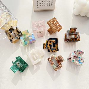 Chic acetate hair claw clips in colorful tortoise and floral patterns for ponytails