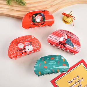 Set di mollette per capelli natalizie con motivi di Babbo Natale nei colori rosso e verde