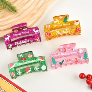 Lot de quatre pinces à cheveux de Noël en acrylique coloré avec paillettes et motifs festifs