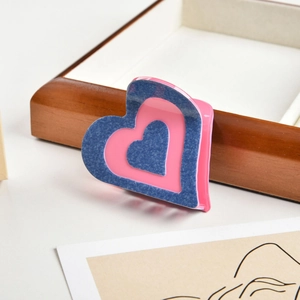 Pink acetate heart hair claw with denim texture pattern for women's hairstyles