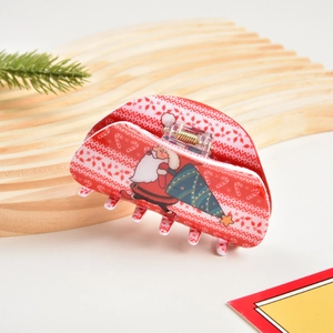 Dettaglio molletta per capelli rossa natalizia con motivi Babbo Natale su legno