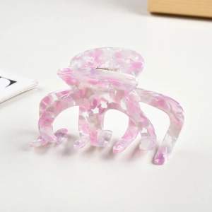 Detailansicht der Oktopus-Haarklammer mit rosa-weißem Marmormuster aus Acetat-Material