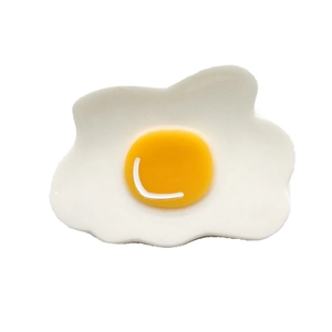 Pince à cheveux en acétate avec un design d'oeuf au plat unique aux tons blanc et jaune