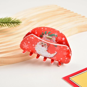 Dettaglio molletta capelli natalizia rossa con Babbo Natale e stampe di fiocchi di neve