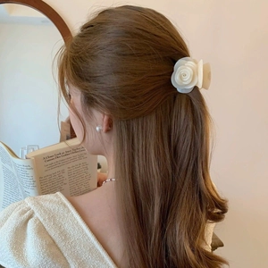 Elegant cream-white rose hair claw clip in a minimalist aesthetic half-up hairstyle