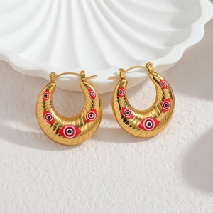 Boucles d'oreilles créoles dorées vintage avec motifs œil du diable et fini texturé