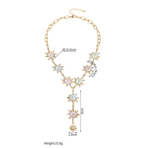 Detailed view of irregular sun enamel necklace with macaron pendants and sizing metrics