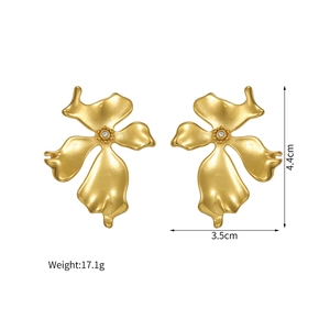 Detail showing dimensions of vintage gold flower earrings with matte finish and center diamond