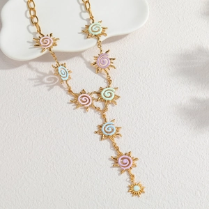Irregular sun pendant necklace with macaron enamel spirals on a gold-tone chunky chain